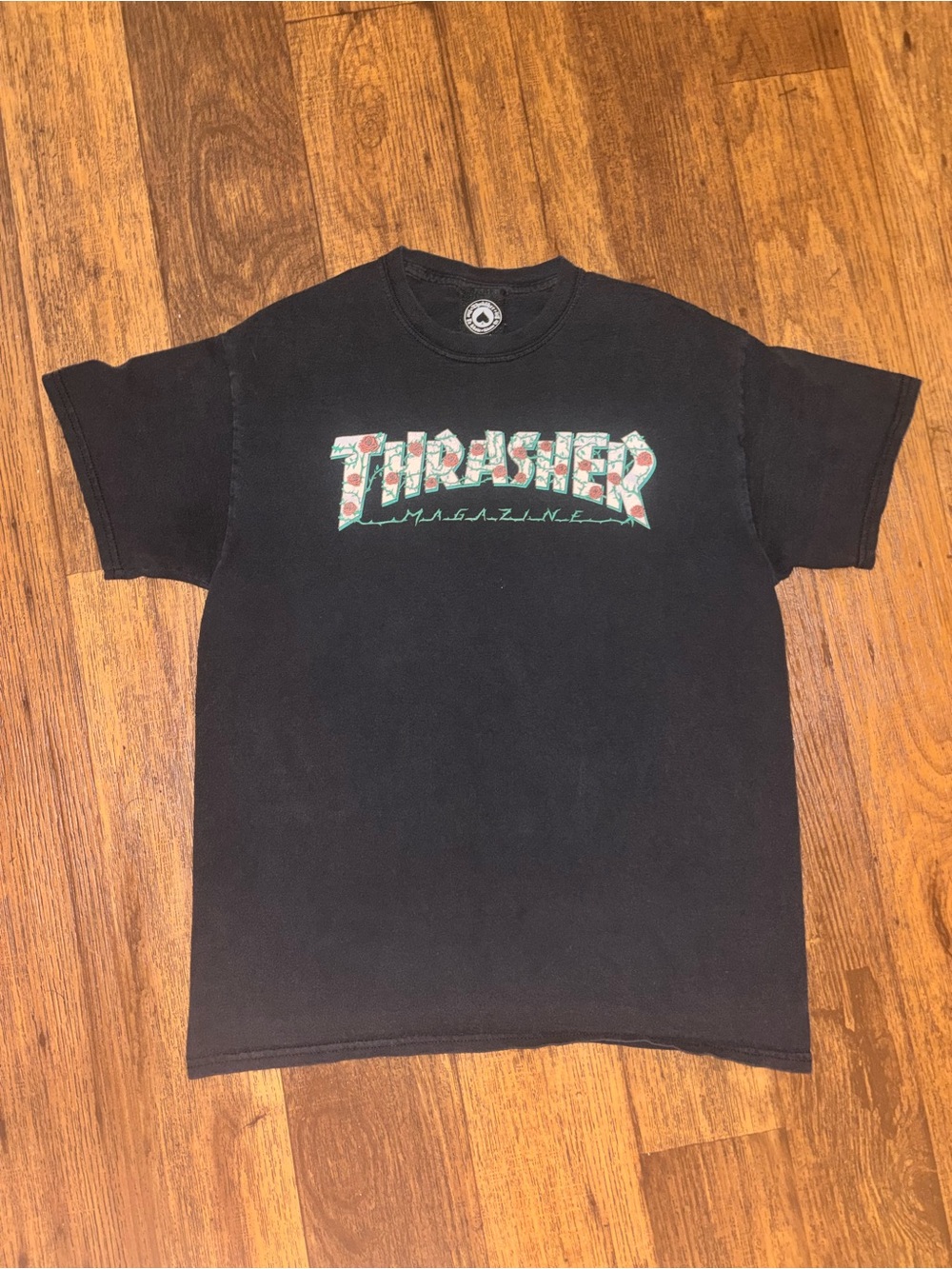 Thrasher Black Tee with Green and Red Floral Logo